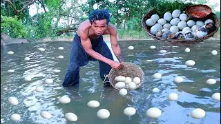 survival in forest - Man finding baby duck egg & take to cook - Eating delicious