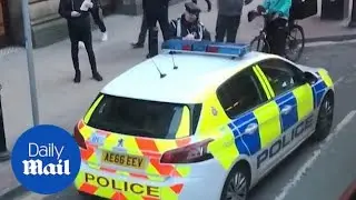 Moment determined traffic warden gives a police car a ticket