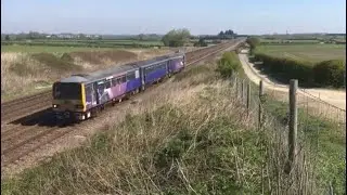 Pacer Class 144 with graffiti passes Colton Junction