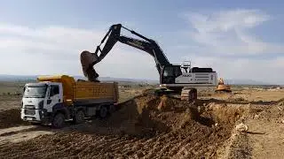 Hidromek 500LC Yüklüyor Doosan DX140 Kazıyor
