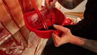 Artist uses real blood to protest Trump