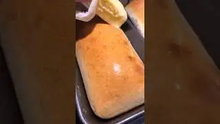 Buttering fresh-baked bread hot out of the oven. #freshlybakedbread #bread #bakeryitems