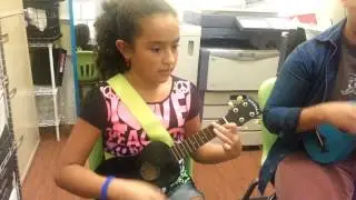 Jazmin playing ukulele with Mr. Jack from SoFLo Music School!
