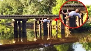 Redneck jumps off bridge and does back flop