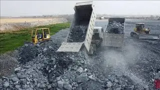 Step-by-Step Guide for Using Bulldozer and Dump Truck on Big Projects pushing rock