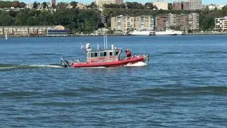 FDNY MARINE UNIT MEMBERS SALUTING TOP FDNY OFFICIALS DURING BLESSING OF THE FLEET CEREMONY IN NYC.6