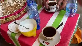 Tour Guide in Addis Ababa Tasting Coffee during a cultural Ethiopian Coffee Ceremony
