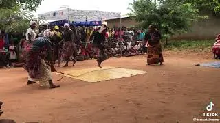 AFRICAN WOMEN DANCING WHILE SKIPPING THE ROPE