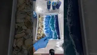 Pouring epoxy resin waves in a tray with beautiful seashell shoreline #karenhammondart #resinartist