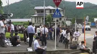 Japanese police search knife suspect's house