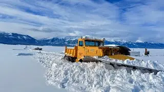 1948 Oshkosh snowplow truck pushing snow.