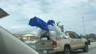 Pickup on I-95 overloaded with too much stuff