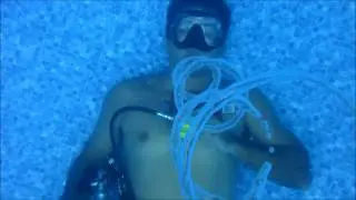 Learning to blow bubble rings in the pool.