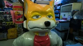 Trying to buy Nintendo 64 games at retro specialist Super Potato in Akihabara.