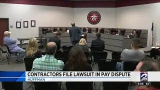 Contractors file lawsuit in pay dispute
