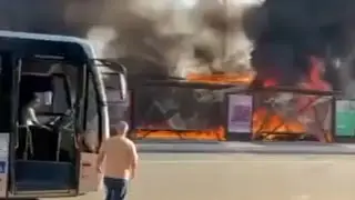 Plane crashes onto road and hits bus