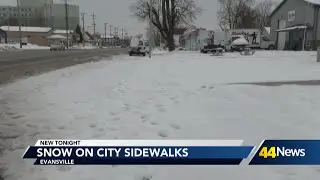 Snow on Evansville sidewalks