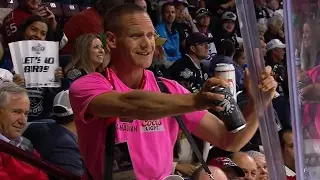 Gotta See It: Vendor continues selling beer while holding stanchion