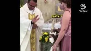 Little girl gives high five to priest. Funny video