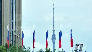 Russian flags fluttering with Ostankino Tower in Moscow city background