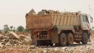 Dump Truck Unloading Big Rock Not Out Help by Excavator Kobelco SK200