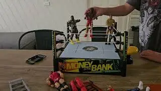 Duke vs Kofi action figures match