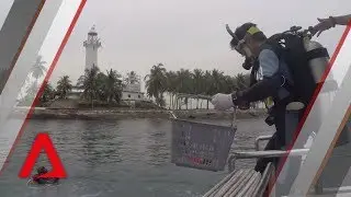 Diving at Raffles Lighthouse: An underwater hunt for trash and treasure