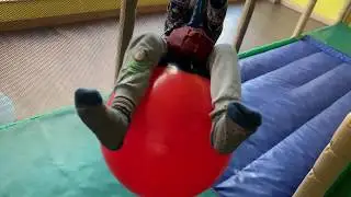 Playing on buoy ball swing