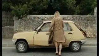 Woman driving her old Renault 5 fast and aggressively