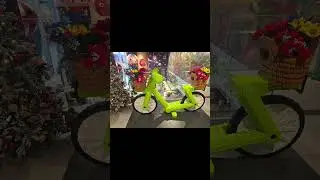 Lego lime-green bicycle by artist Sean Kenney in rome italy