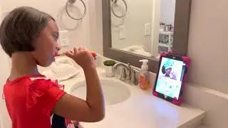 Sydney DeLoach trying out the Colgate Magik toothbrush!