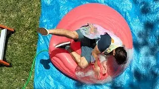 Falling onto a Giant Water Balloon at 12,500fps - The Slow Mo Guys