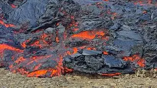 Lava flow burning moss and grass