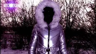 GLITTER SILVER WINTER SKI OVERALLS WITH SNOW-WHEEL HOOD AND MODERN GAS MASKS. WALKS IN THE SCAFANDER