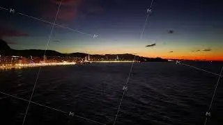 nightfall on tranquil seaside walkway, dusk over peaceful harbor with glowing lights and seagulls