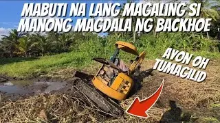 BACKHOE MABUTI NALANG NAKAAHON PA. MAGALING SI MANONG.