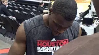 Jeff Adrien of the Houston Rockets signing autographs