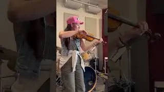Elizabeth A. Davis, rehearsing her song, Empty Boots