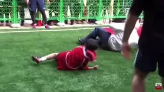 Boris Johnson rugby tackles a child
