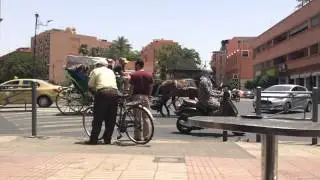 Traffic on Avenue Mohamed V crossing in Marrakech, Morocco.