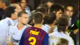 Jose Mourinho pokes the eye of Barcelona coach Tito Vilanova