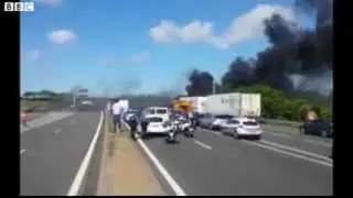 Delays as protestors set tyres on fire in Calais Eurotunnel   BBC News