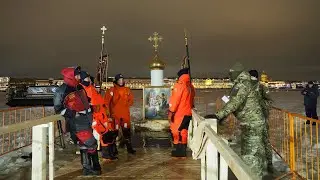 Plunging in ice cold water. A religious ceremony in Russia. Baptism of Christ.