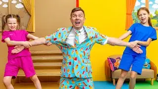 Дети играют в игры и участвуют в челлендже с картонными фигурками.