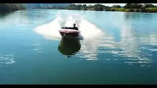 Ski boat, 351, almost takes at drone at speed.