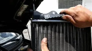 como cambiar radiador Optra fuga