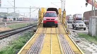 Automobile unloading at Changsari station near Guwahati