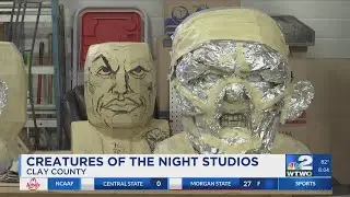 Life-sized paper mâché masks