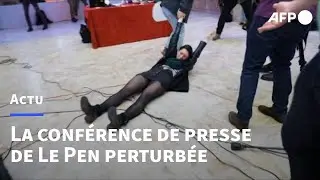 Pr&eacute;sidentielle 2022: des opposants &agrave; Marine Le Pen perturbent sa conf&eacute;rence de presse | AFP