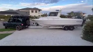 Grenadier towing and launching a Northbank Boat